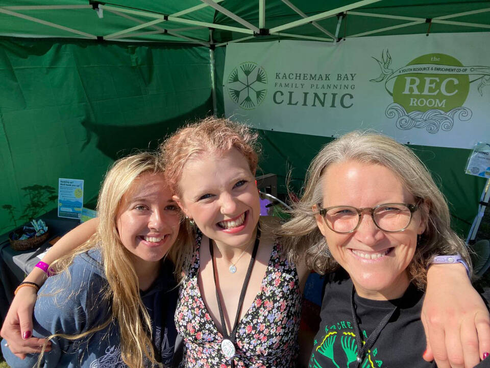 Kachemak Bay Family Planning Clinic volunteers Fiona Hatton and Olivia Glasman and CEO Claudia Haines (right) provide outreach at Salmonfest in 2022. Photo provided by KBFPC