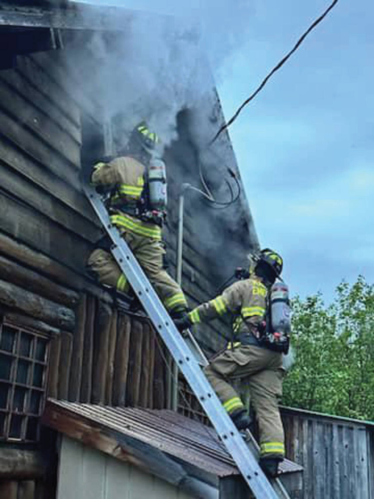 Kachemak Emergency Services personnel work to extinguish a fire at the Fritz Creek General Store east of Homer on East End Road, early Thursday morning on July 6, 2023 in Fritz Creek, Alaska. Photo by Mark Kirko