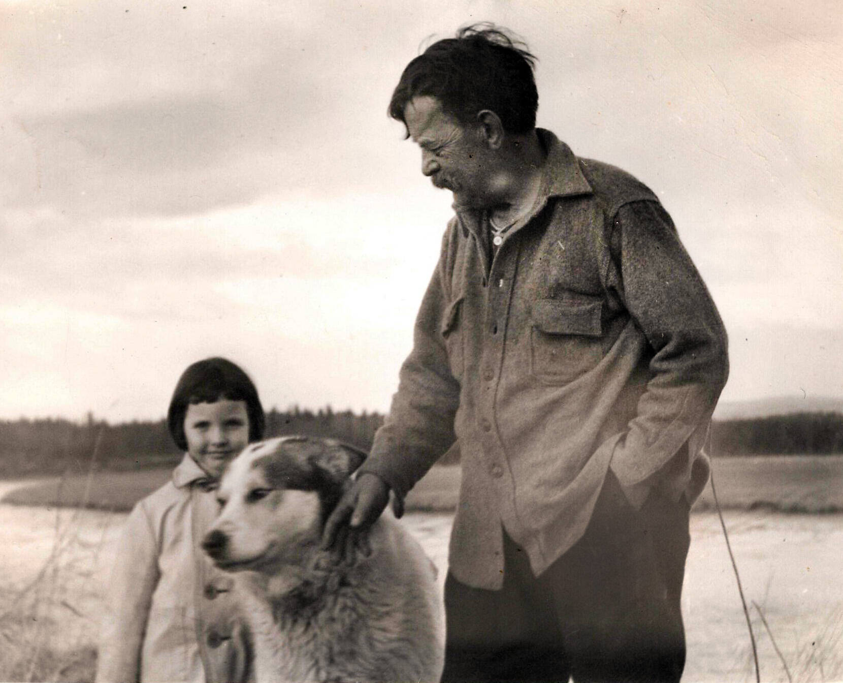 In this Knackstedt Collection photo, probably from circa the 1940s, Windy Wagner enjoys the company of young Lori Lancashire and a friendly dog. (Photo courtesy of the Knackstedt Collection)