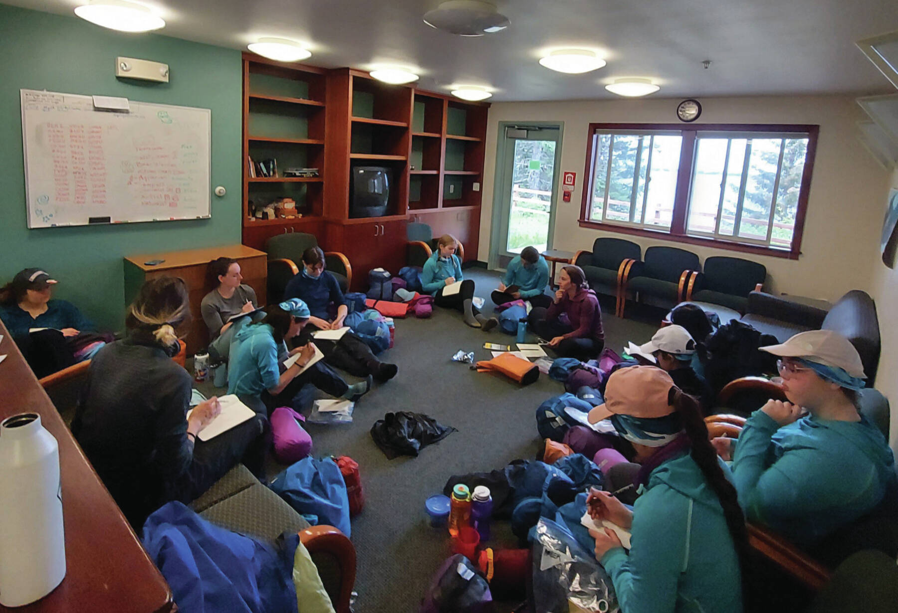 Girls on Water participants prepare gear at the Kasitsna Bay Lab on July 1<ins>,</ins> <ins>2023</ins>. Photo provided by coordinator Alex Ravelo.