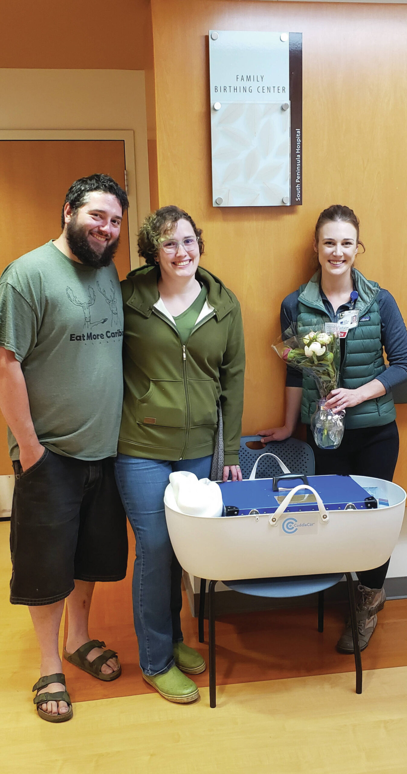 Michael and Jennifer Redding with South Peninsula Hospital's OB/Family Birth Center Director Joelle Burdick and their contribution of a CuddleCot in Homer, Alaska on July 15.  Photo provided by Derotha Ferraro.