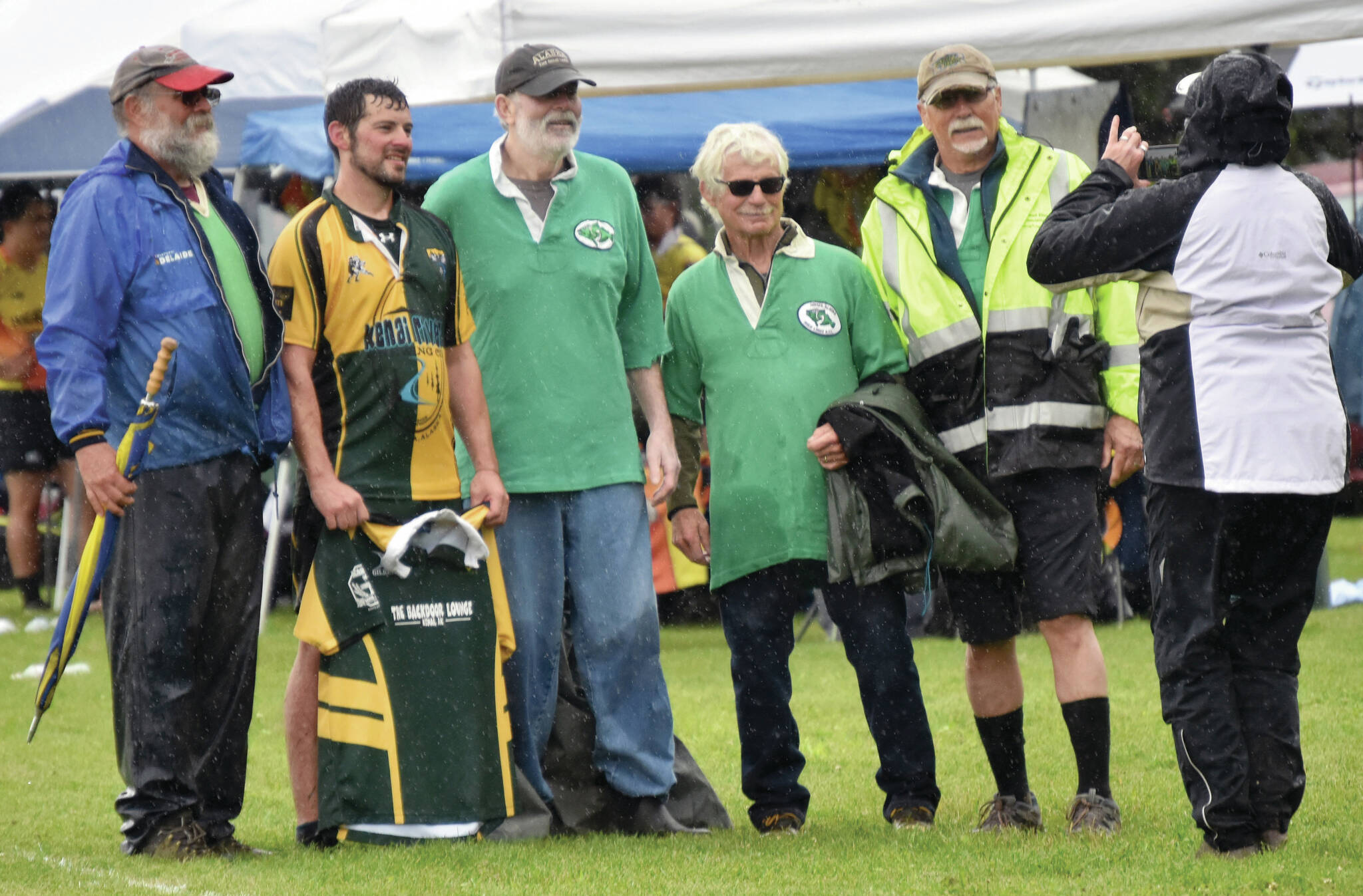 John Fitzpatrick, Dan Balmer, Chip Duggan, Tom Klinker and Wayne Aderhold pose at the Between the Tides Rugby Tourney at Millennium Square Field on Saturday. Fitzpatrick, Duggan, Klinker and Aderhold used to play for the Homer Irish Lords. Balmer is the president and coach for the Kenai Wolfpack.