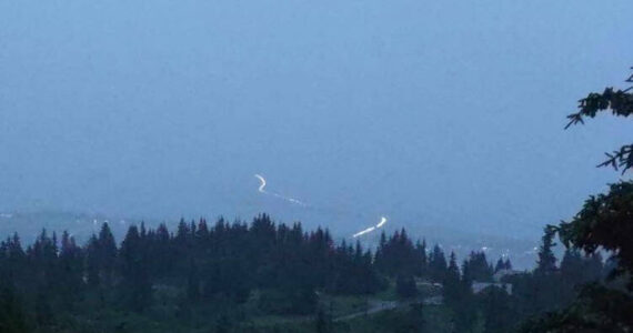 A photo taken from Skyline Drive at about 11:20 p.m. Saturday, July 15, 2023, shows vehicles evacuating from the Homer Spit after a tsunami warning was issued. The warning did not affect the Homer area, but sirens sounded anyway. The warning was later canceled. (Photo by Shannon Cefalu/courtesy)