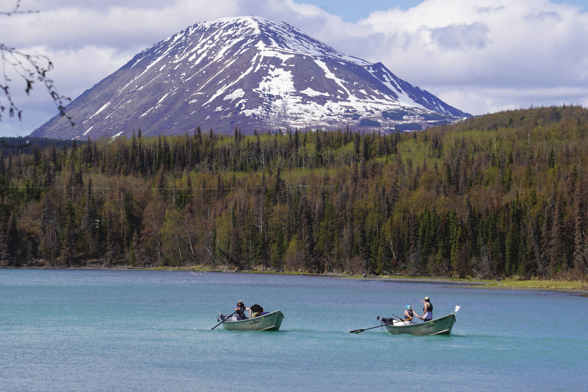 Contestants race down the Kenai River during the 16th Annual Cooper Landing Drift Boat Regata near the Eagle Landing Resort in Cooper Landing, Alaska on Saturday, May 20, 2023. (Jake Dye/Peninsula Clarion)