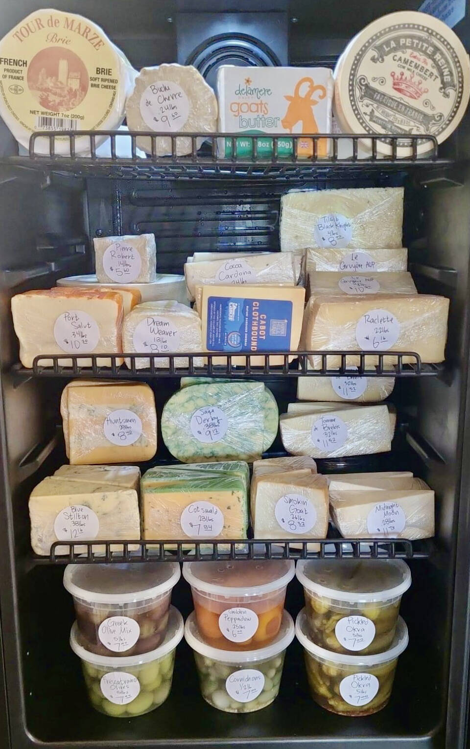 An assortment of cheeses, olives and other specialty items that rotate through Alasandro’s Market on Heath Street is on display at the shop. Photo courtesy of Jacob Chrisman