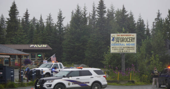 Alaska State Troopers investigate a shooting scene on Monday, Aug. 23, 2021, at the Anchor Point Warehouse in Anchor Point, Alaska, at the store on the Sterling Highway in which an Alaska State Trooper was shot.(Photo by Michael Armstrong/Homer News)