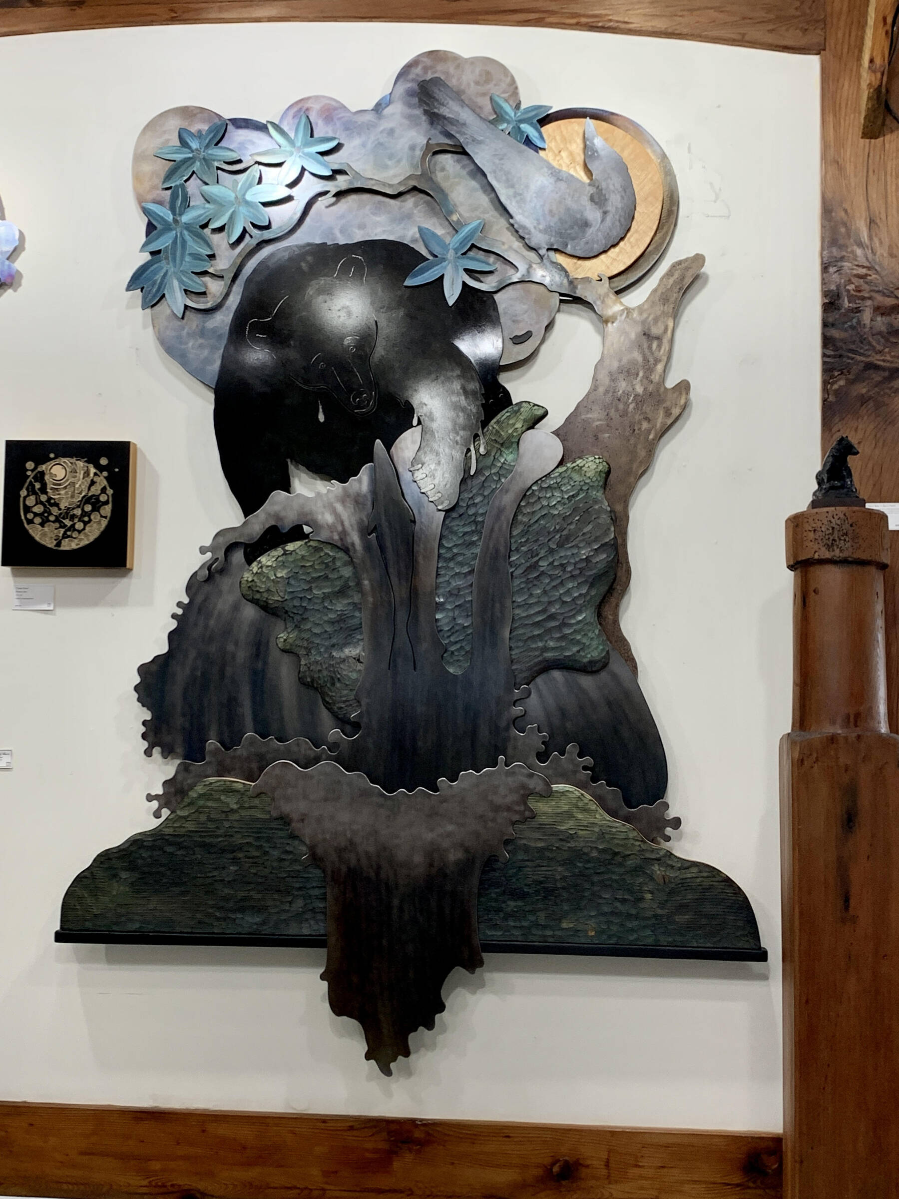 “Fishing Bear with Raven,” a wall sculpture by Homer artist Jeff Dean, is on display at Creative Fire Studios out East End Road through August in Homer, Alaska. Photo provided by Jeff Dean