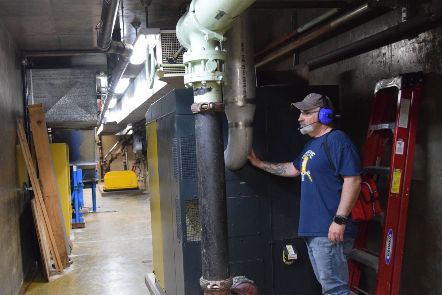 Superintendent Todd Cook explains the capabilities of the newly-installed blowers compared to the old units at the Homer Sewer Treatment Plant on Thursday, July 27, 2023 in Homer, Alaska. (Delcenia Cosman/Homer News)