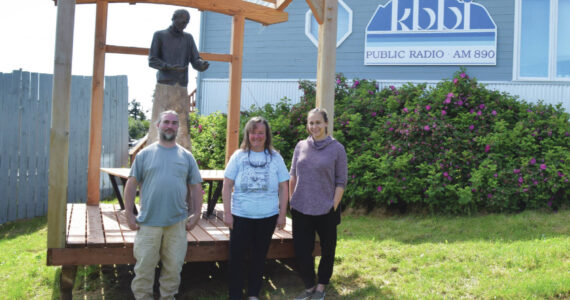 Emilie Springer/Homer News
Josh Krohn, Kim Wylde and Loren Barrett stand in front of the Brother Asaiah statue at KBBI on Monday.