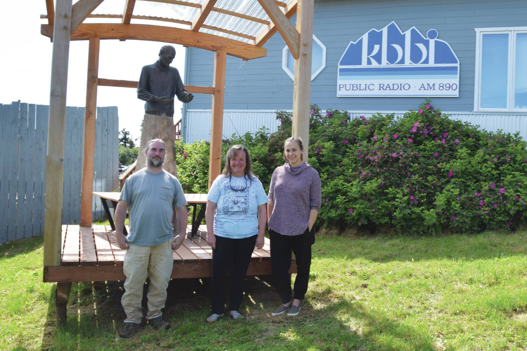 Emilie Springer/Homer News
Josh Krohn, Kim Wylde and Loren Barrett stand in front of the Brother Asaiah statue at KBBI on Monday.