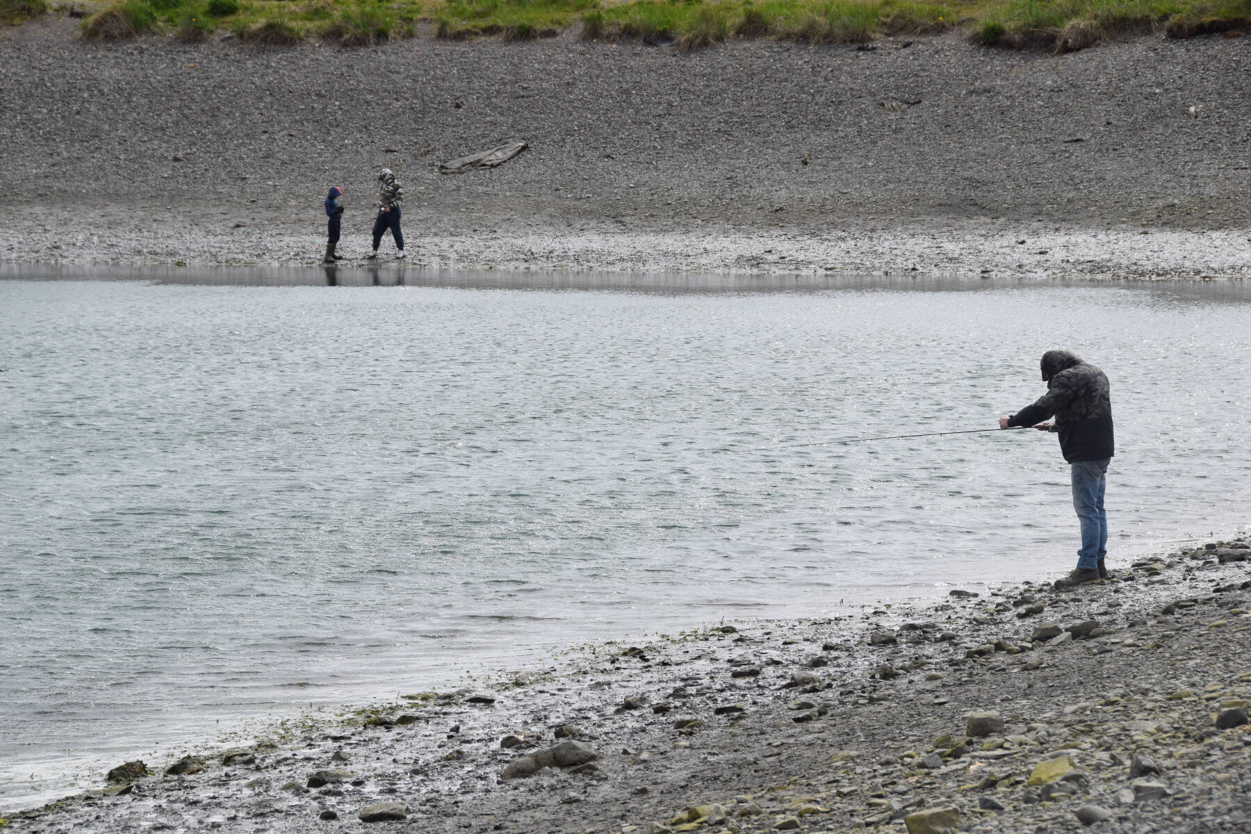 Local youth anglers participate in the 15-and-under king salmon fishery on Saturday, June 3, 2023, at the Nick Dudiak Fishing Lagoon in Homer, Alaska. (Delcenia Cosman/Homer News)
