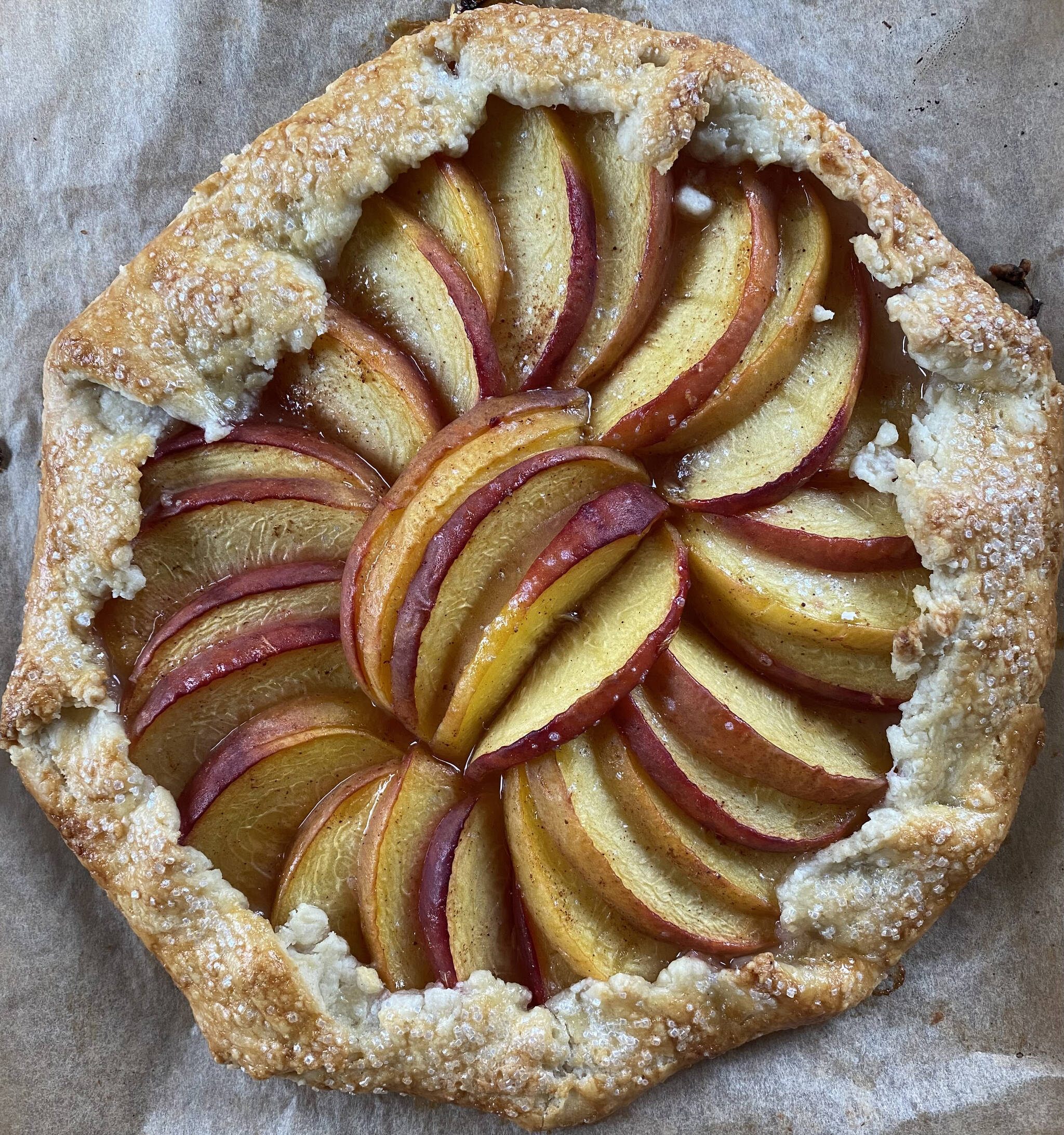 Fresh ripe peaches are wrapped in a buttery crust in this peach galette recipe. (Photo by Tressa Dale/Peninsula Clarion)