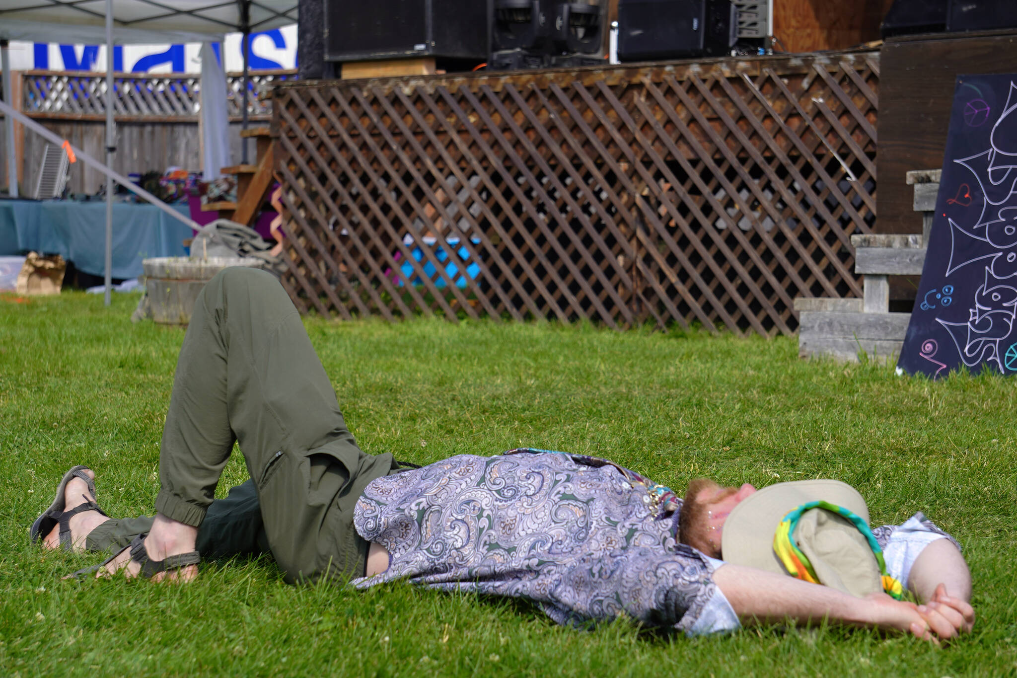 An attendee dozes between performances on the Ocean Stage at Salmonfest in Ninilchik, Alaska, on Friday, Aug. 4, 2023. (Jake Dye/Peninsula Clarion)
An attendee dozes between performances on the Ocean Stage at Salmonfest in Ninilchik, Alaska, on Friday, Aug. 4, 2023. (Jake Dye/Peninsula Clarion)