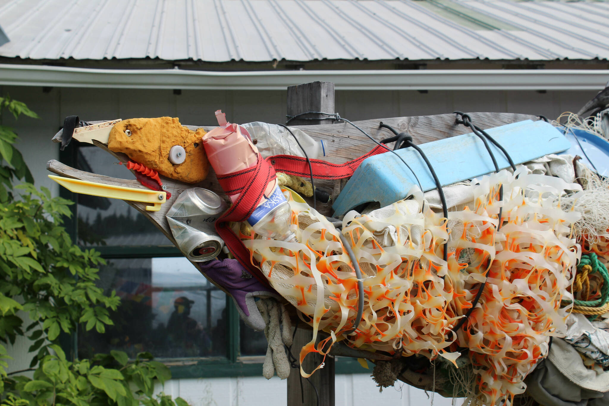A salmon made out of trash is displayed at Salmonfest on Friday, Aug. 4, 2023 in Ninilchik, Alaska. (Ashlyn O’Hara/Peninsula Clarion)