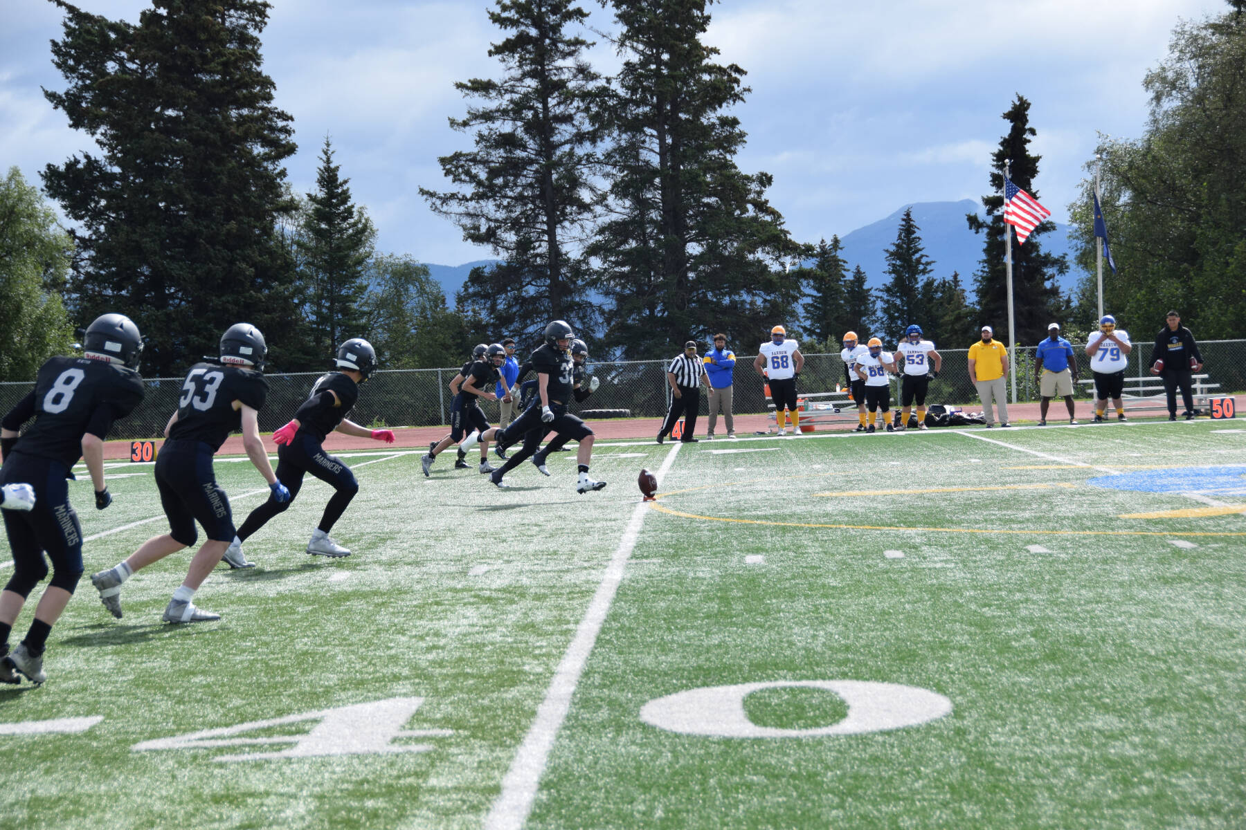 Mariner running back Jake Tappan kicks off the home opener varsity game on Saturday, Aug. 12, 2023 at the Homer High School football field in Homer, Alaska. (Delcenia Cosman/Homer News)
