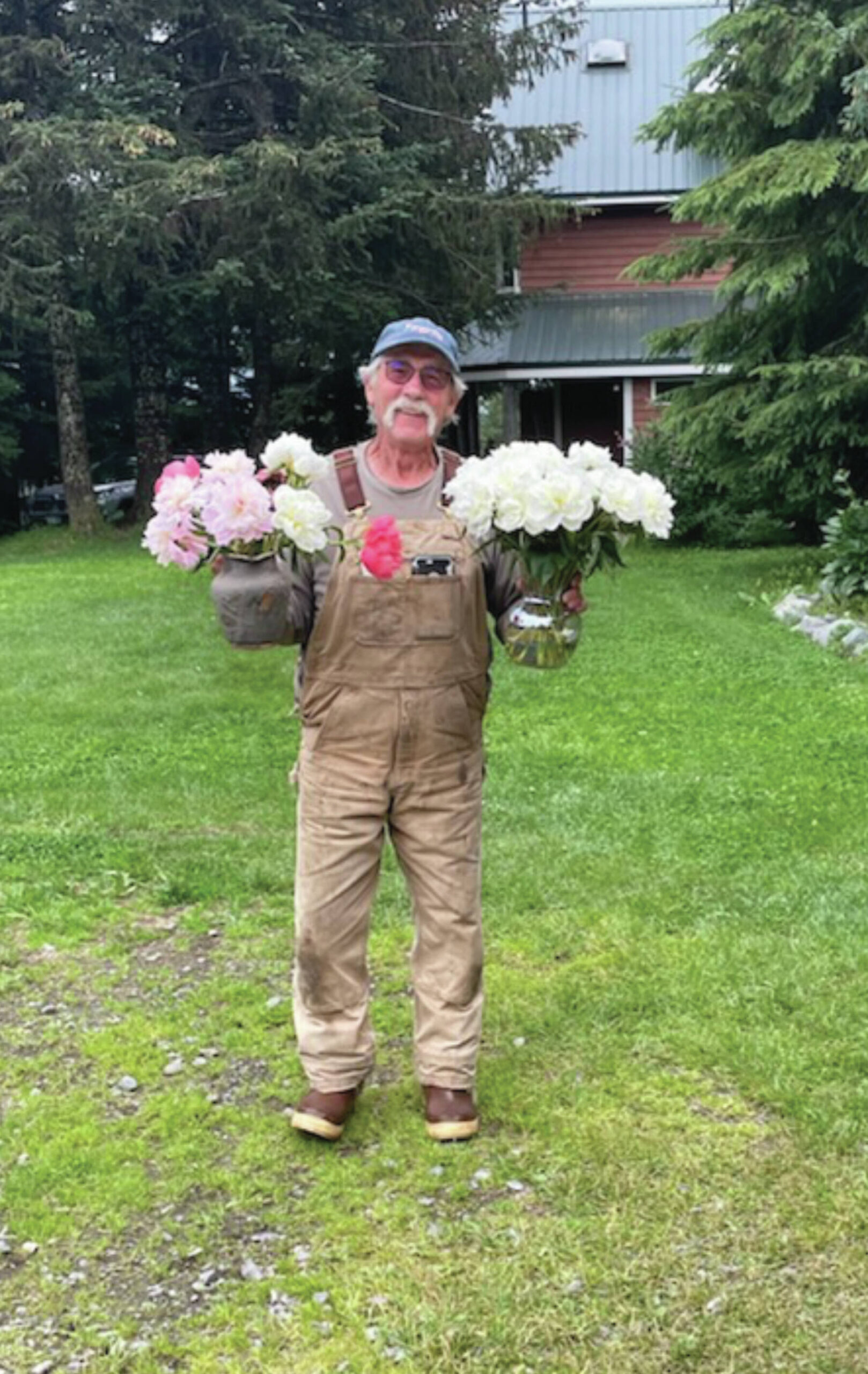 Sean Martin with flowers at Diamond Ridge Peony Farm in Homer on August 11.