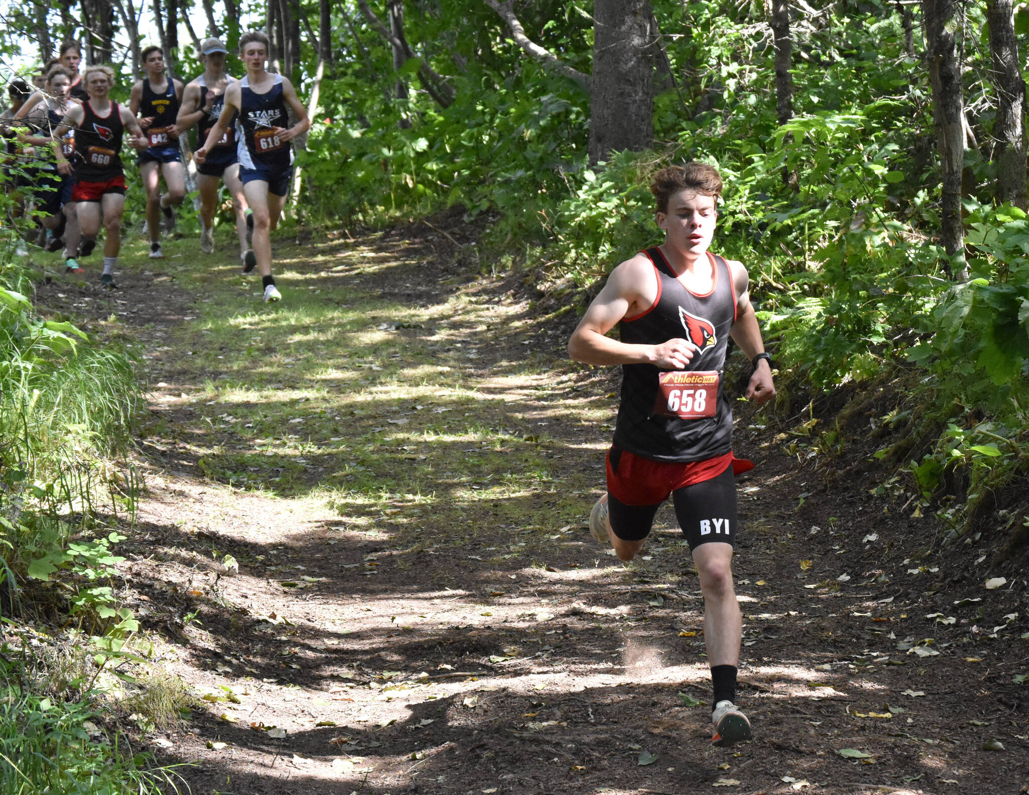 Greg Fallon takes a commanding lead on the way to victory in the junior-senior boys race at the Class Races on Monday, Aug. 14, 2023, at Nikiski High School in Nikiski, Alaska. (Photo by Jeff Helminiak/Peninsula Clarion)