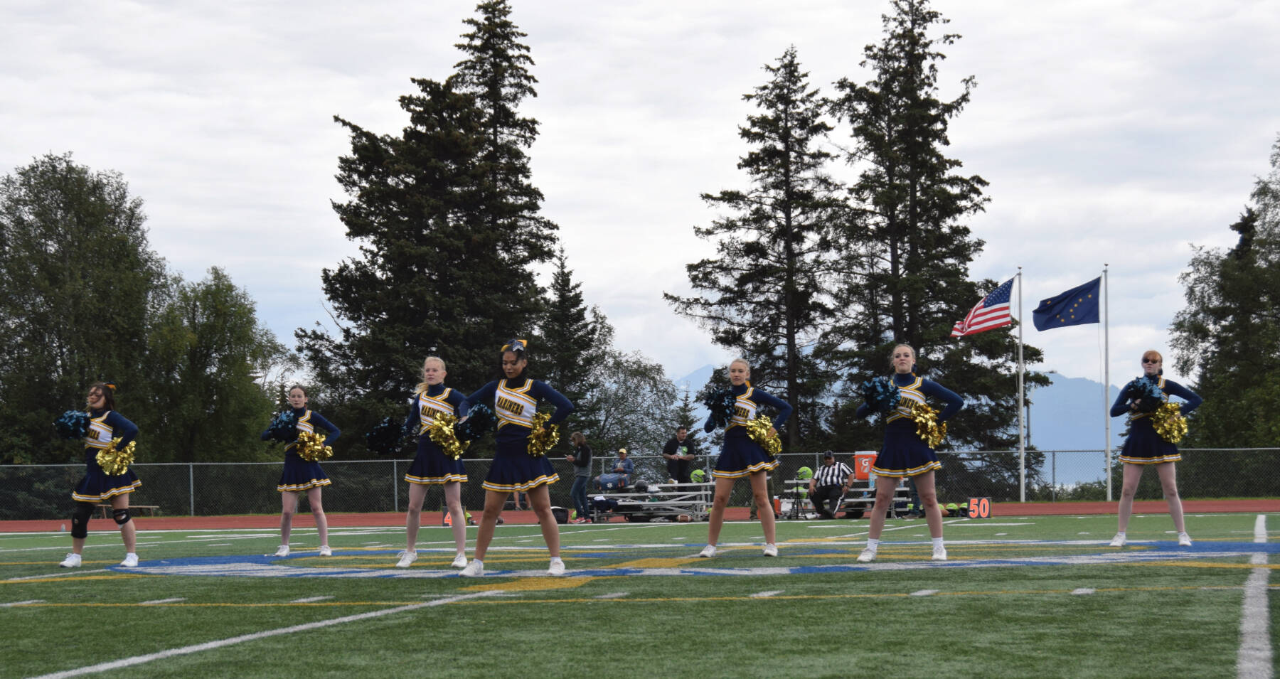 The Homer Mariner cheer team performs their halftime show at the home game against Redington on Saturday, Aug. 19, 2023 in Homer, Alaska (Emilie Springer/Homer News)