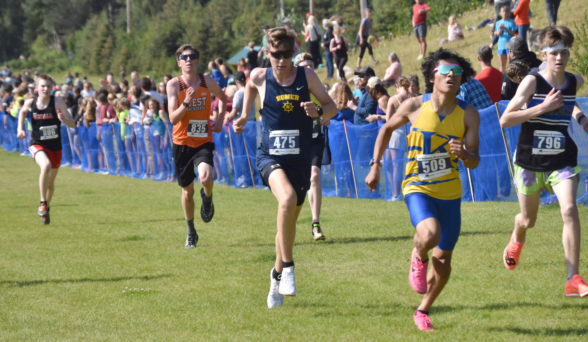 Homer’s Ethan Styvar sprints to the finish in the boyss varsity race at the Ted McKenney Invitational on Saturday, Aug. 19, 2023, at Tsalteshi Trails just outside of Soldotna, Alaska. (Photo by Jeff Helminiak/Peninsula Clarion)