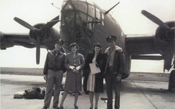 Larry and Rusty Lancashire (at left) pose in front of a B-24 bomber in the early 1940s with another unidentified couple. Larry was a B-24 co-pilot during World War II. (Photo courtesy of the Lancashire Family Collection)