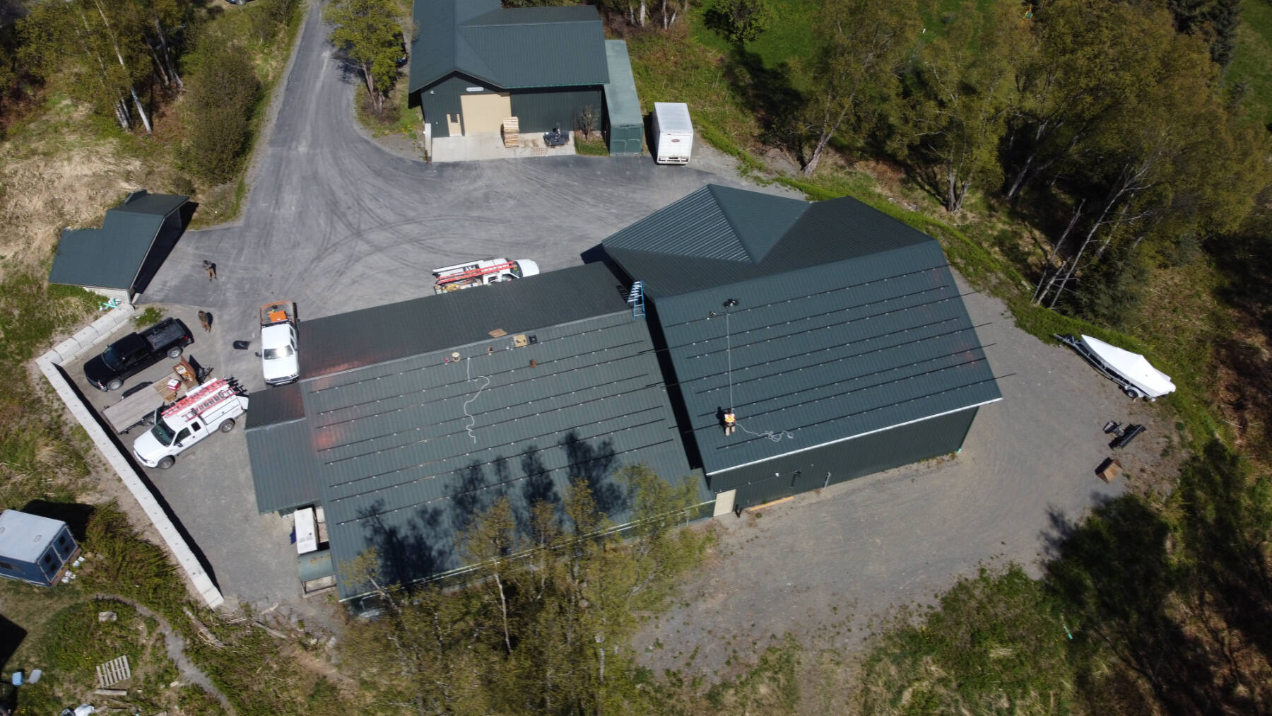Midnight Sun Solar, LLC installs the solar array on the roof of Bear Creek Winery’s bottling works facility in June 2022. Photo provided by Alexander Sievers