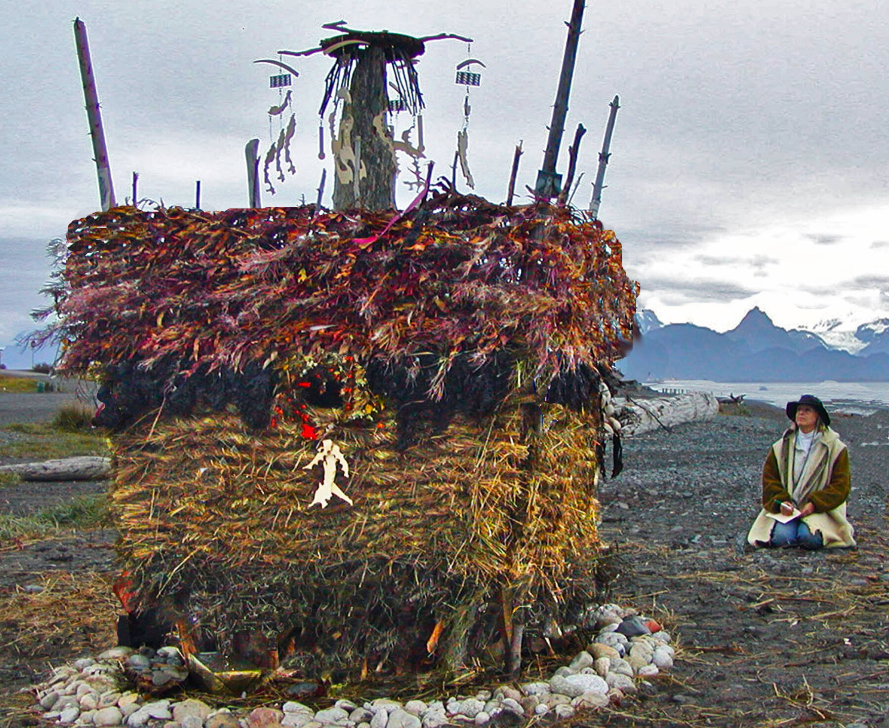Homer artist Mavis Muller sits next to “Adieu,” the first Burning Basket created in 2004 by Muller with help from community volunteers in Homer, Alaska. Photo provided by Mavis Muller