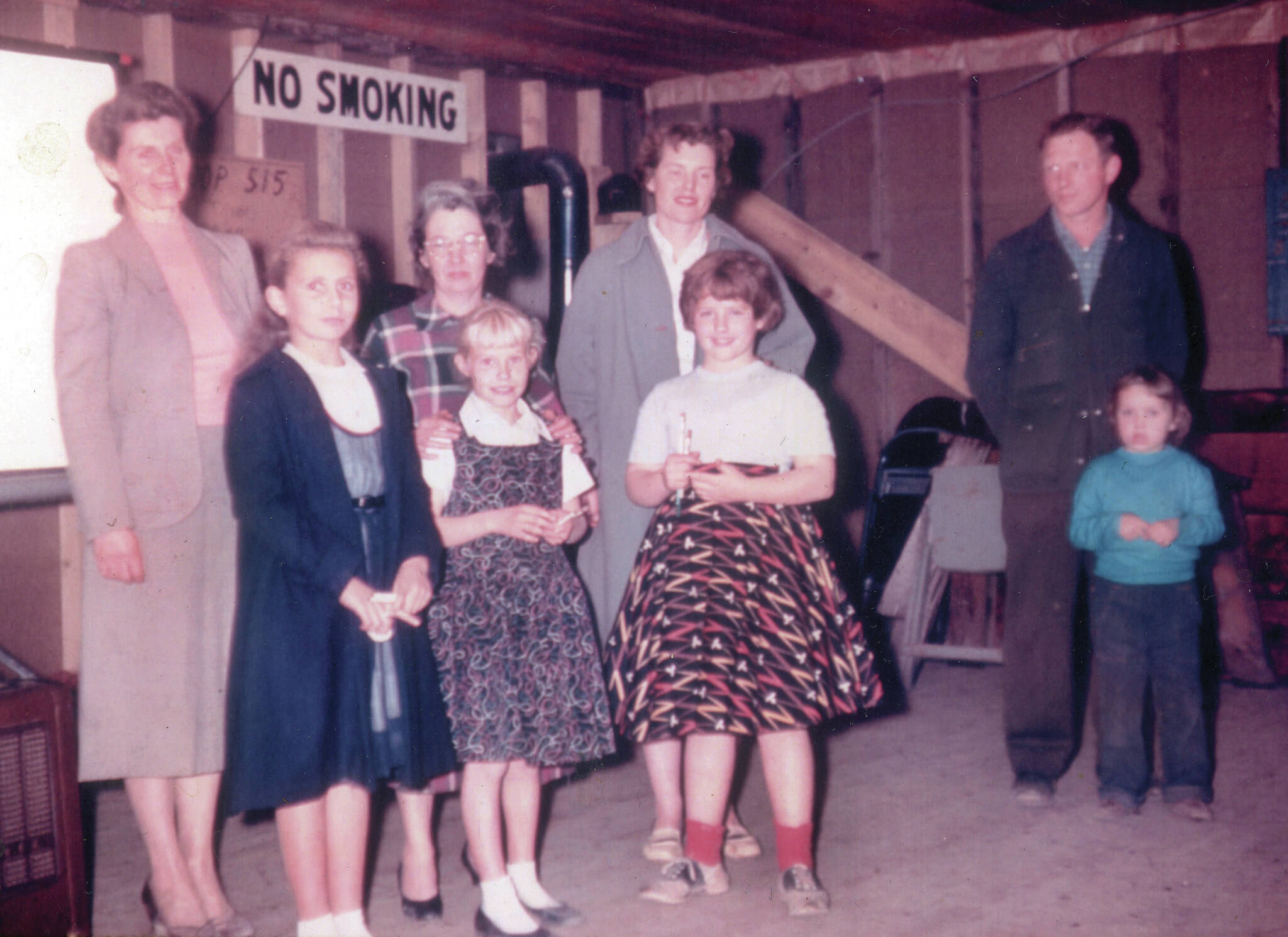 Ray Sandstrom photo courtesy of the Lancashire Family Collection
A 4-H Club meeting in the mid-1950s in the Soldotna Community Club: (L-R) Marge and Eileen Mullen, Virginia and Joyce Gibbs, Rusty and Abby Lancashire, and U.S. Home Extension agent Ed Liebenthal and his daughter.