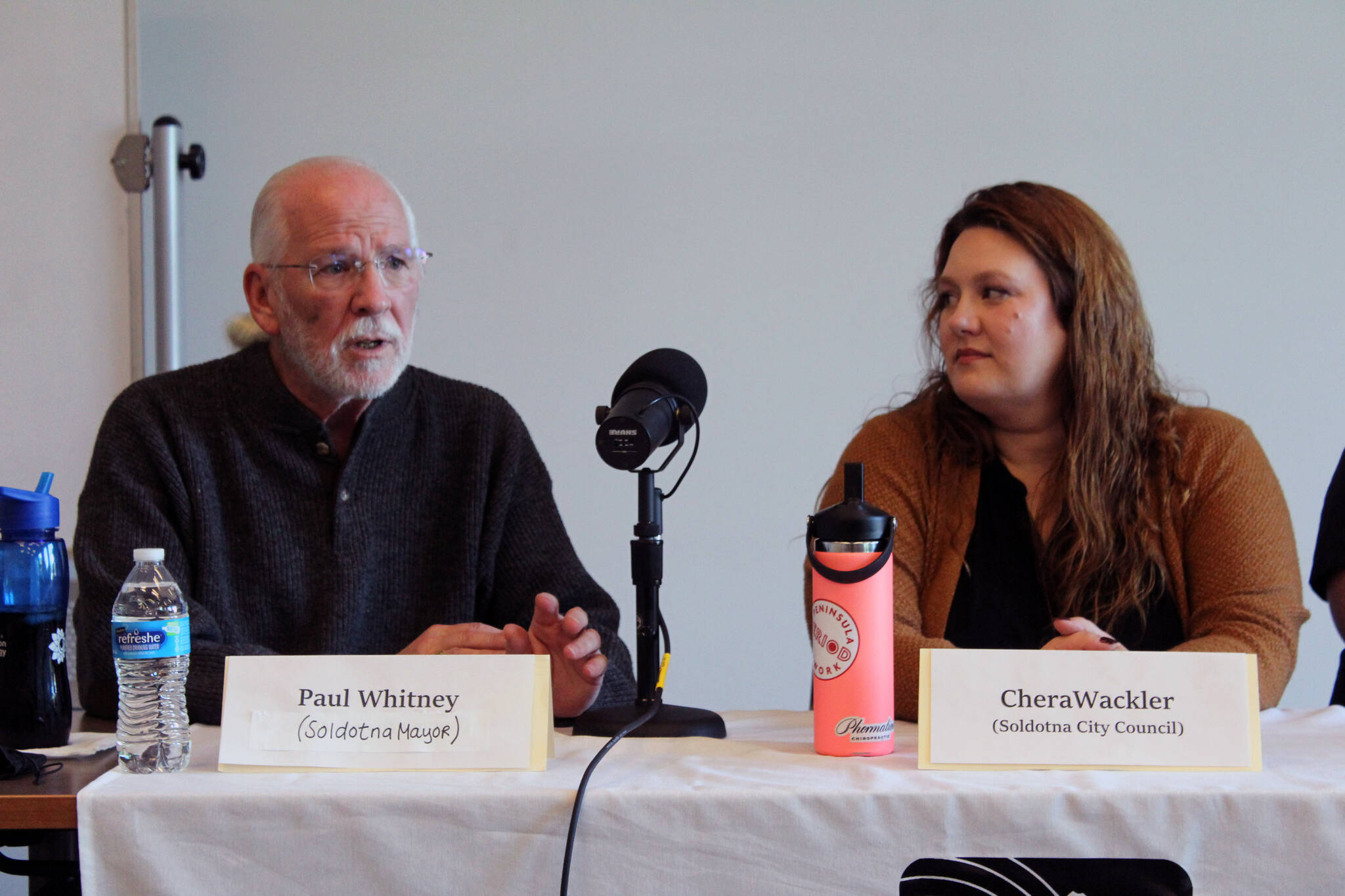 Paul Whitney and Chera Wackler participate in a Soldotna City Council candidate forum at the Soldotna Public Library in Soldotna, Alaska, on Monday, Sept. 4, 2023. (Jake Dye/Peninsula Clarion)