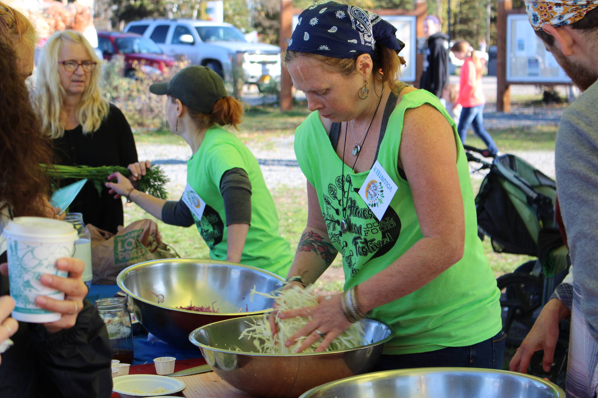 Volunteers work the fermentation station at the Harvest Moon Local Food Festival at Soldotna Creek Park on Sept. 14, 2019. (Photo by Brian Mazurek/Peninsula Clarion)