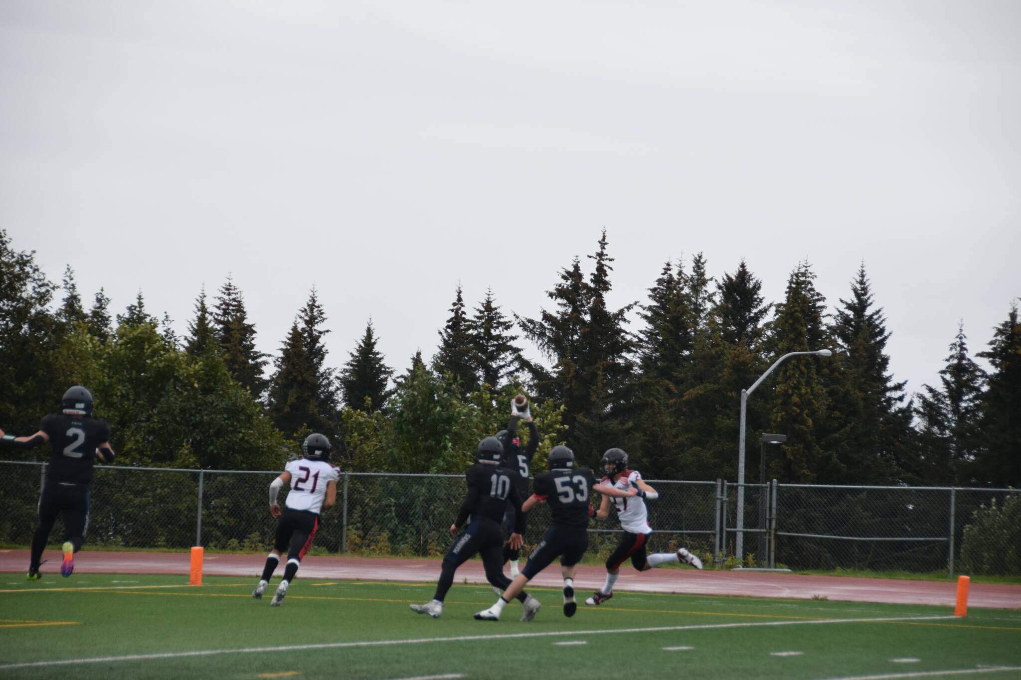 Homer defensive back Landan Branstetter intercepts a pass from Houston behind the five yard line during the varsity game against the Hawks on Saturday, Sept. 16, 2023 in Homer, Alaska. (Delcenia Cosman/Homer News)