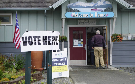 A line of voters runs out the door of the Diamond Ridge Voting Precinct at the Homer Chamber of Commerce and Visitor Center on Election Day, Tuesday, Aug. 16, 2022, in Homer, Alaska. Chamber Executive Director Brad Anderson said he had never seen the amount of people coming through the polling place. (Photo by Michael Armstrong/Homer News)