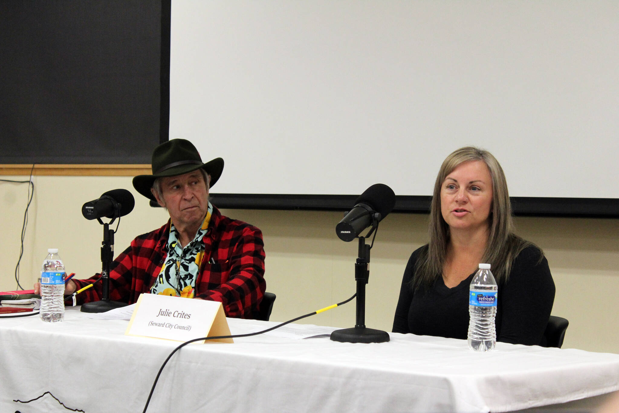 Brad Snowden and Julie Crites participate in a Seward City Council candidate forum at the Seward Community Library in Seward, Alaska, on Thursday, Sept. 21, 2023. (Jake Dye/Peninsula Clarion)
