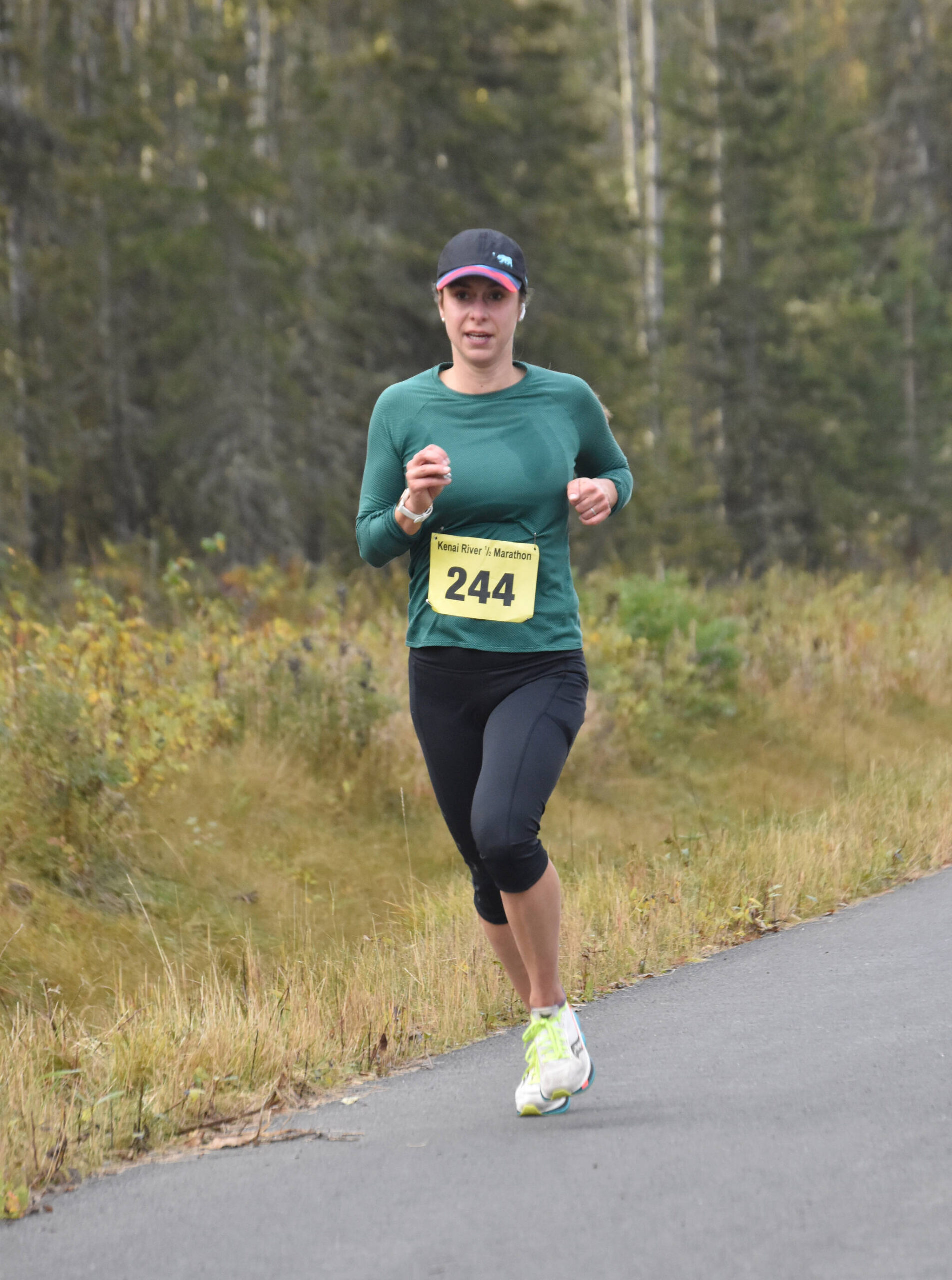 Samantha Wilson of Anchorage runs to victory in the women’s half marathon at the Kenai River Marathon on Sunday, Sept. 24, 2023, in Kenai, Alaska. (Photo by Jeff Helminiak/Peninsula Clarion)