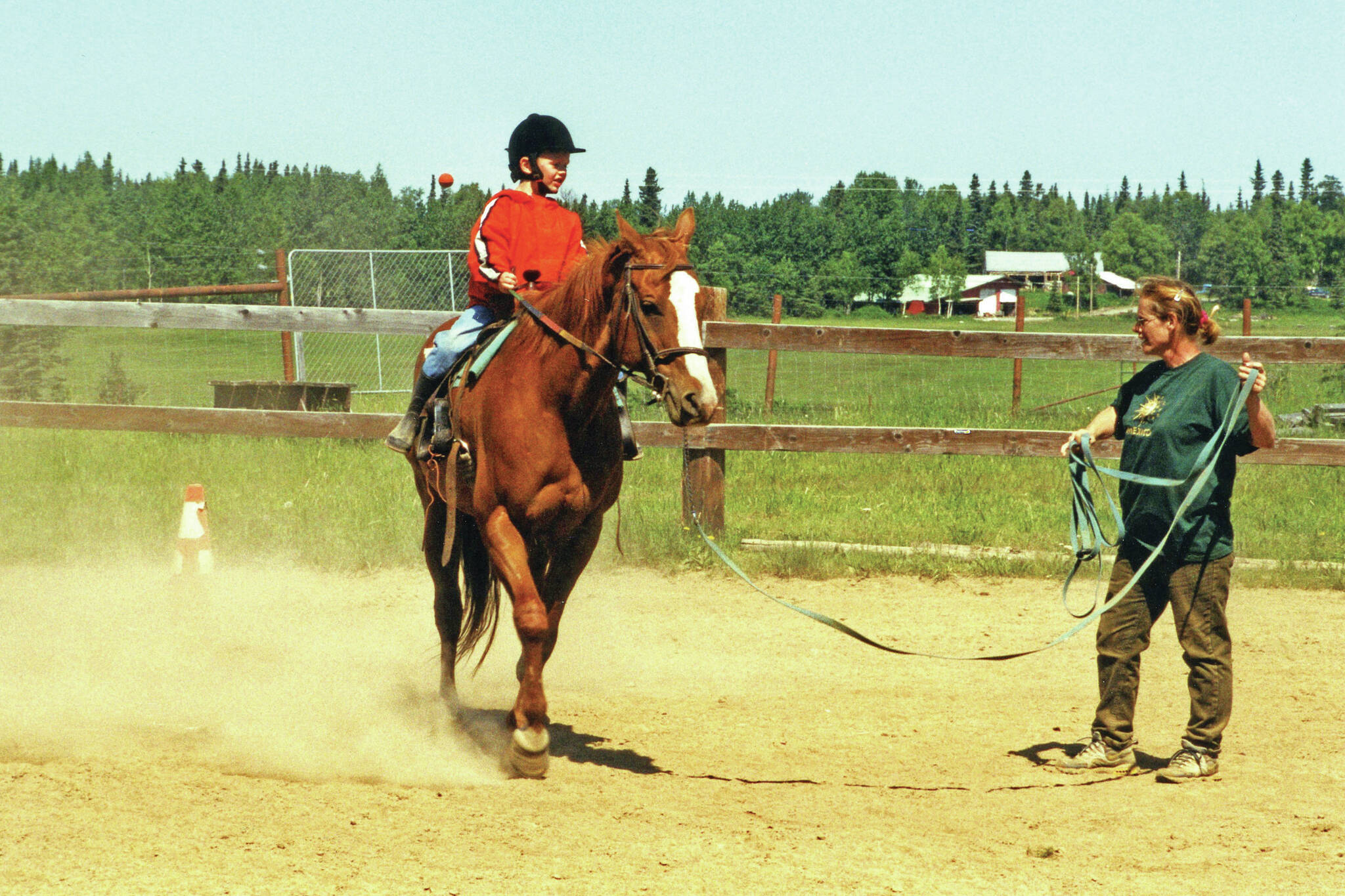 For many years, Abby (Lancashire) Ala (standing) gave horseback riding lessons at her home, the site of her longtime business, Ridgeway Farms. (Clark Fair photo from 2001)