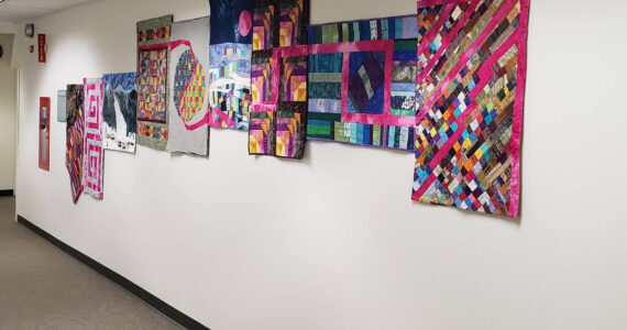 “We Are All Connected,” quilts by Homer quilters on display at South Peninsula Hospital, in Homer, Alaska. (Photo provided)