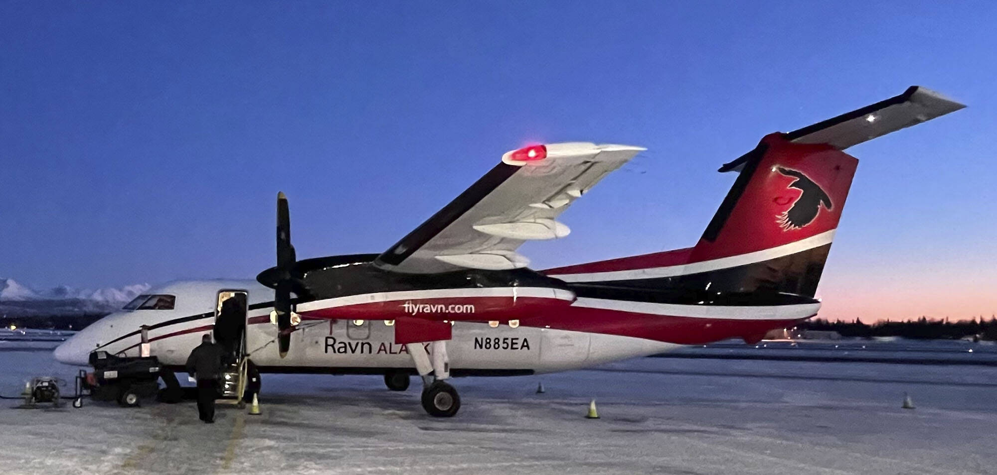 Passengers board a Raven Dash-8 in Anchorage for a flight to Kenai in this file photo. The airline has announced it is discontinuing service to Kenai. (Photo Courtesy M. Scott Moon)