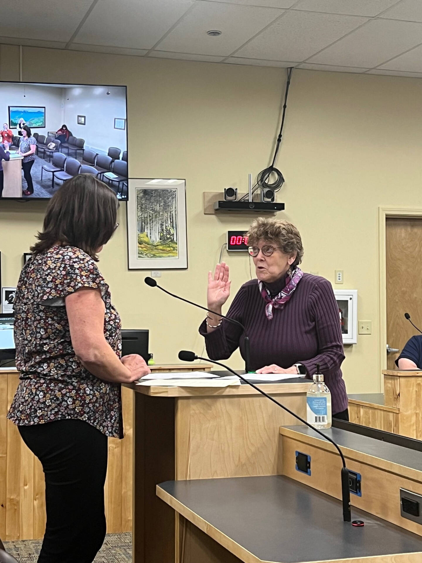 Newly re-elected Homer city council member Caroline Venuti (right) recites the oath of office administered by city clerk Melissa Jacobsen (left) during the city council regular meeting on Monday, Oct. 9, 2023 in the Cowles Council Chambers at City Hall in Homer, Alaska. Photo courtesy of Mike Illg