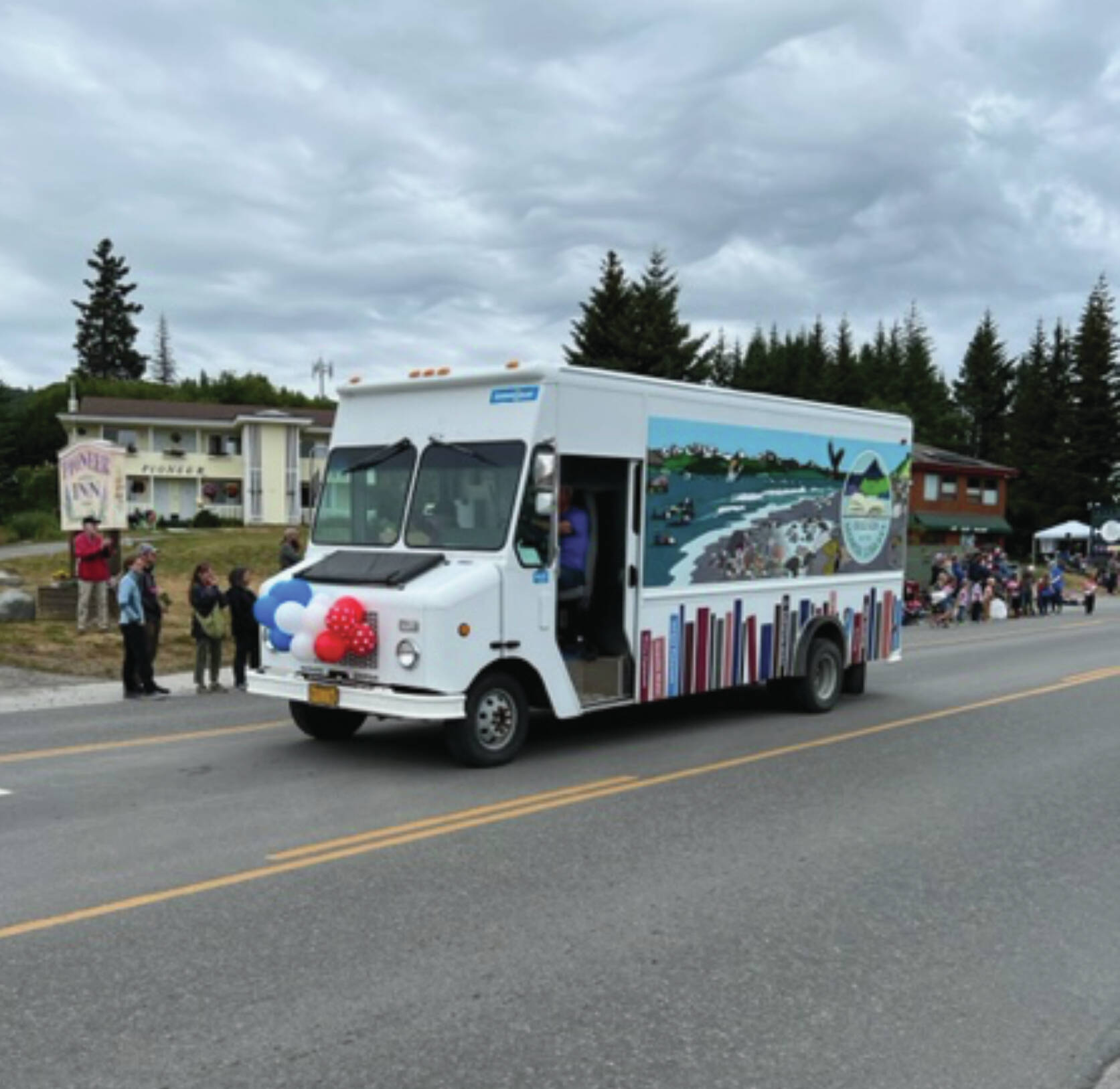 Homer Public Library's BOB the bookmobile ends the 2023 summer season.  The bookmobile participates here in the Homer Fourth of July parade.  Photo provided by Lin Hampson.