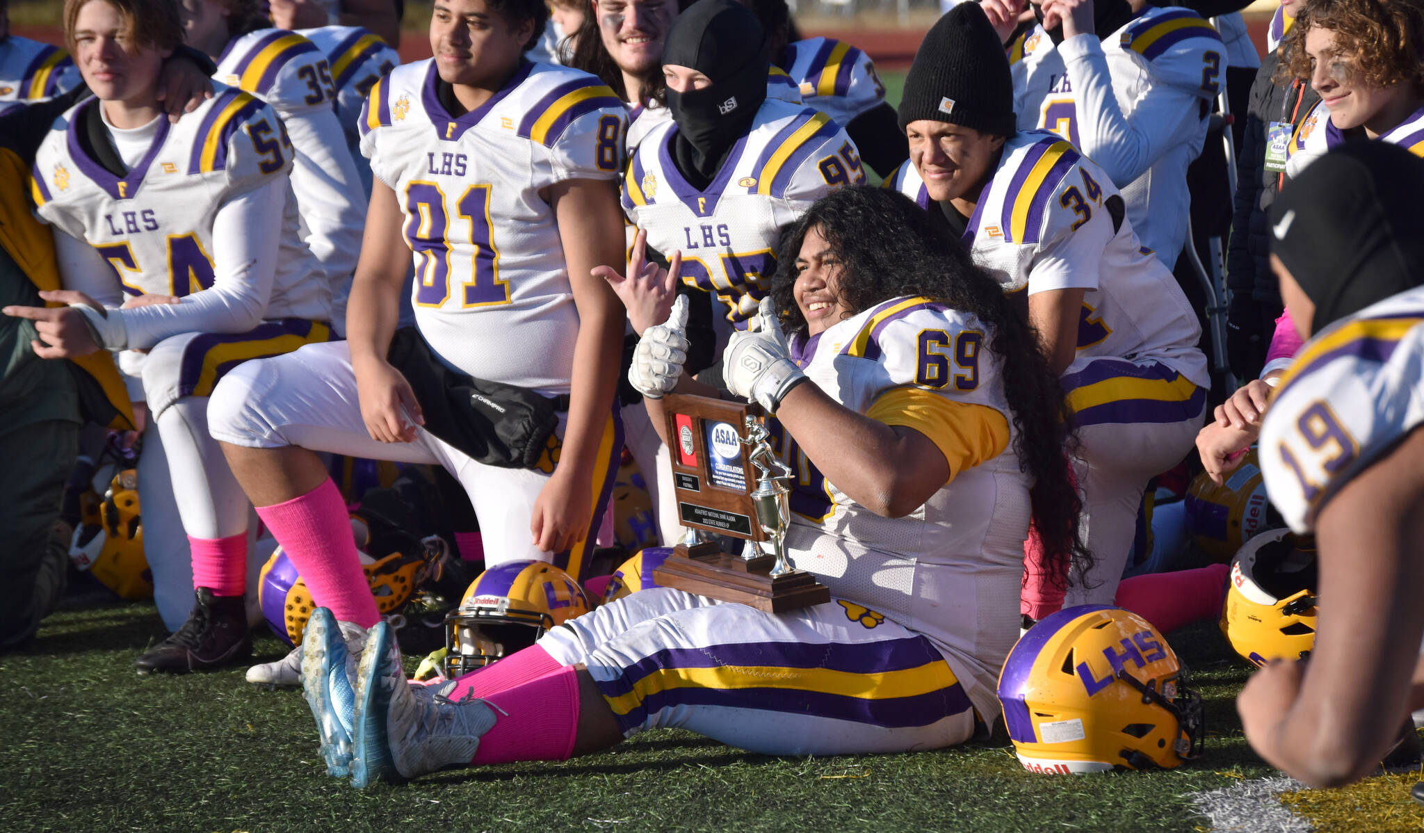 Lathrop’s Zedekiah Fanene poses with the runner-up trophy Saturday, Oct. 21, 2023, in the Division II championship game at Service High School in Anchorage, Alaska. (Photo by Jeff Helminiak/Peninsula Clarion)