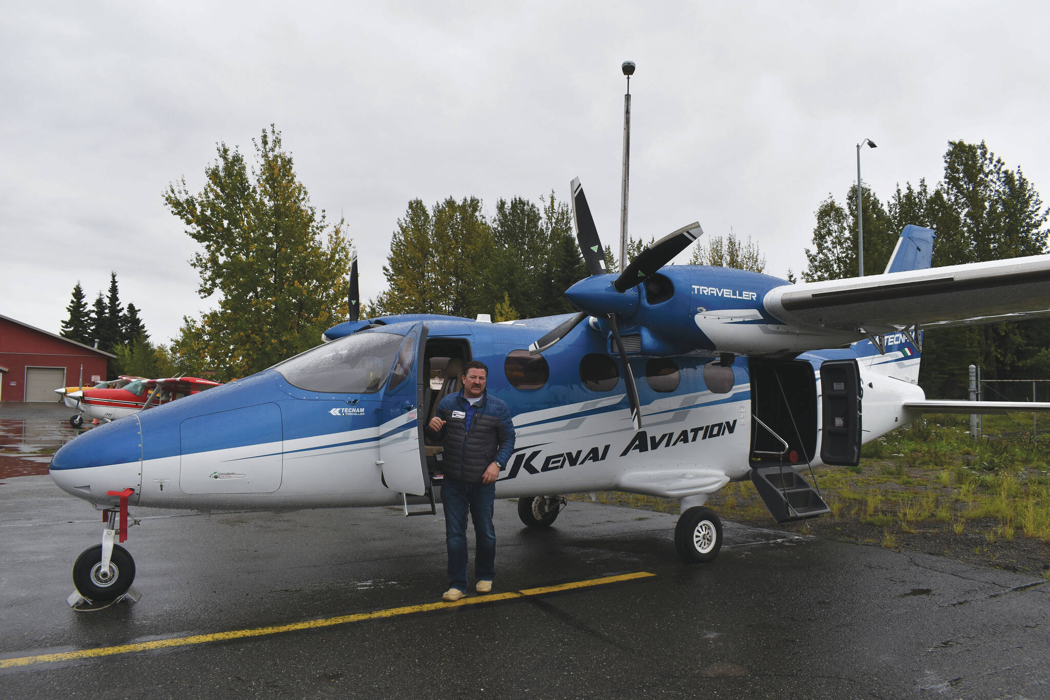 Joel Caldwell shows off the new Tecnam Traveller on Thursday, Sept. 15, 2022 in Kenai, Alaska. (Jake Dye/Peninsula Clarion)