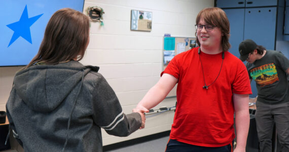 Lincoln Kimbell shakes hands with Boyd Lehmberg after winning the final round of a Super Smash Bros. Ultimate match at Nikiski Middle/High School in Nikiski, Alaska, on Monday, Oct. 23, 2023. (Jake Dye/Peninsula Clarion)