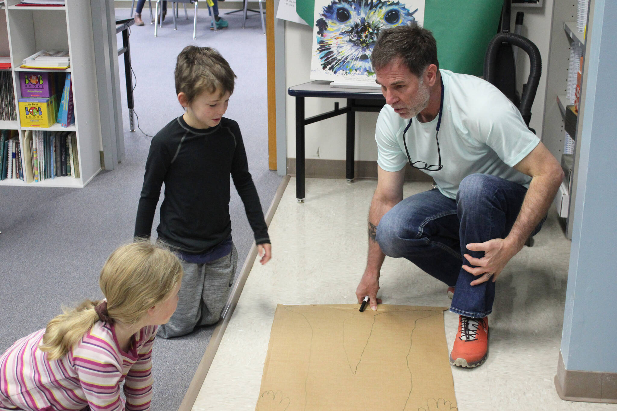 Hope School K-5 teacher Jeremy McKibben leads third grade students in an activity associate with CKLA’s “How Does Your Body Work?” unit on Wednesday, Oct. 18, 2023, in Hope, Alaska. (Ashlyn O’Hara/Peninsula Clarion)
