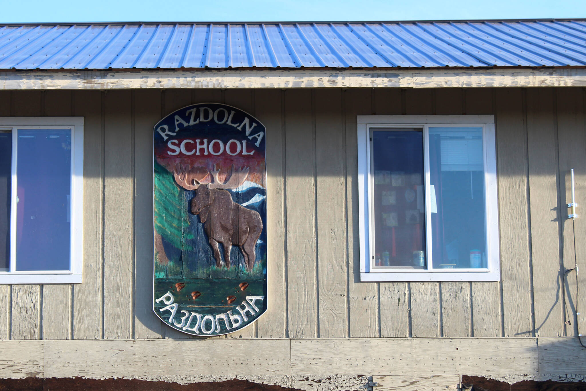 A sign marks the entrance to Razdolna School on Tuesday Oct. 24, 2023, in Razdolna, Alaska. (Ashlyn O’Hara/Peninsula Clarion)