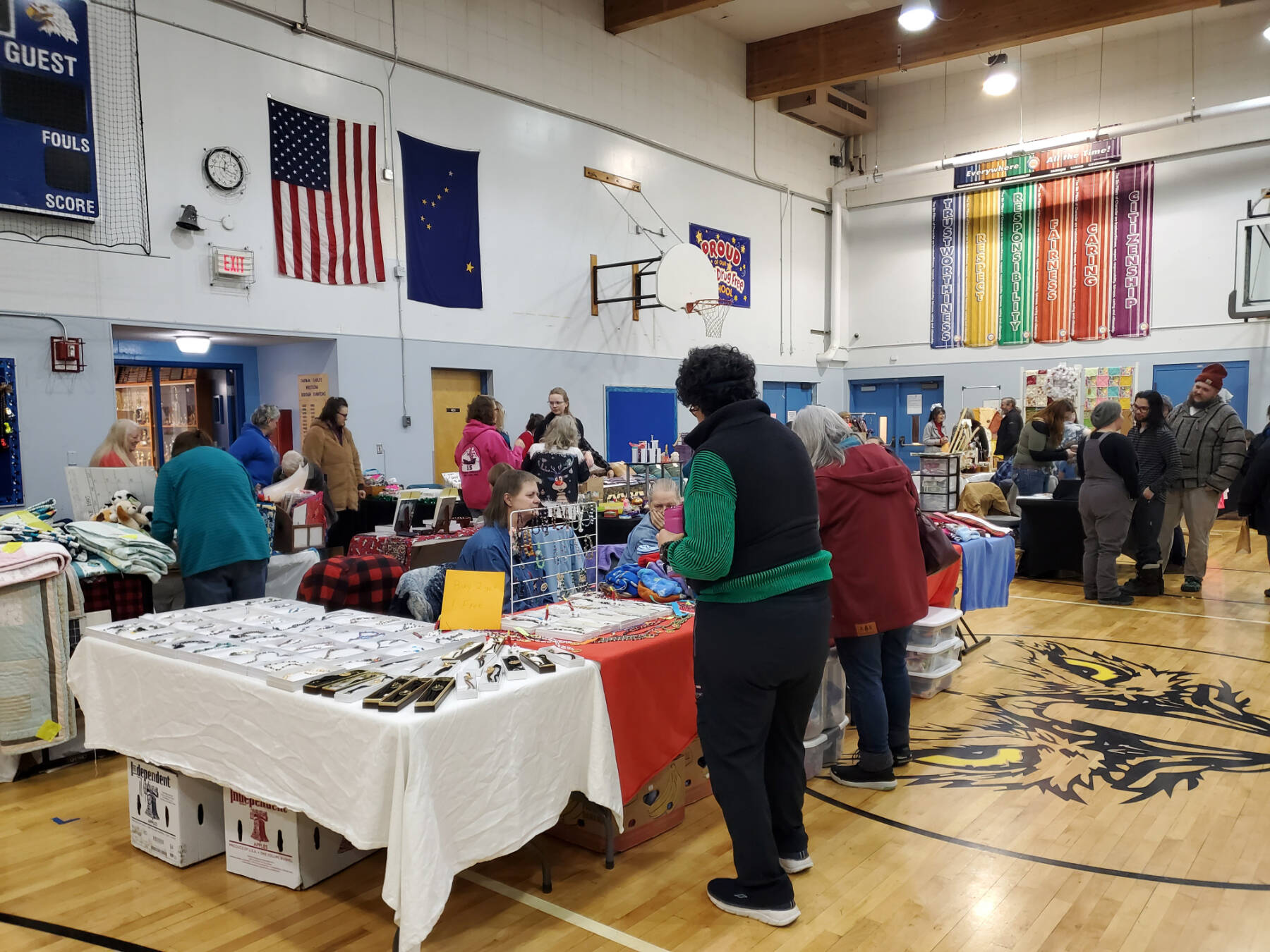 Community members browse the wares at the Anchor Point Holiday Bazaar at Chapman School on Saturday, Nov. 25, 2023 in Anchor Point, Alaska. (Delcenia Cosman/Homer News)