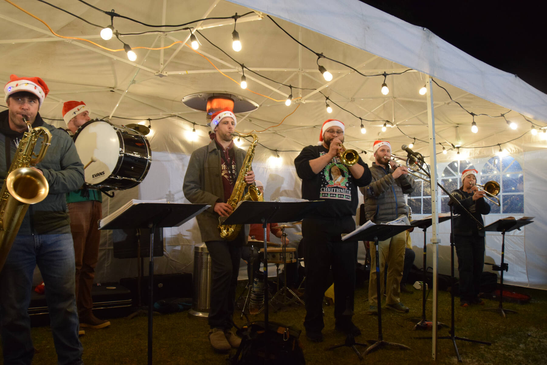 The KP Brass Band performs Christmas songs at the annual Holiday Tree Lighting on Thursday, Nov. 30, 2023 at the Homer Chamber of Commerce in Homer, Alaska. (Delcenia Cosman/Homer News)