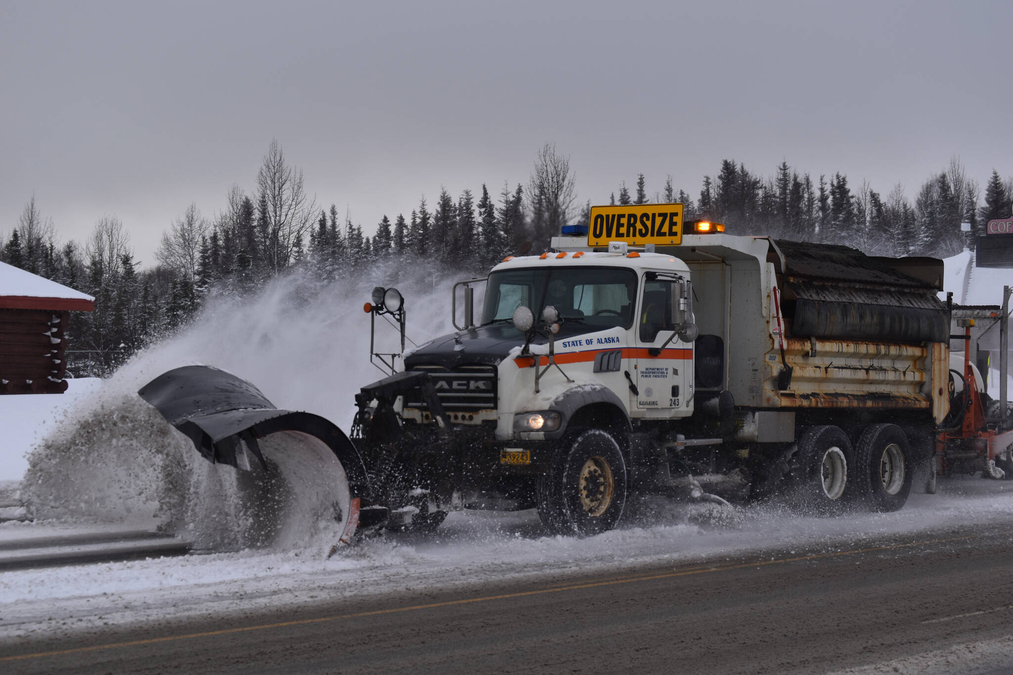A state plow truck clears snow from the Kenai Spur Highway on Wednesday, Nov. 2, 2022, in Kenai, Alaska. (Jake Dye/Peninsula Clarion)