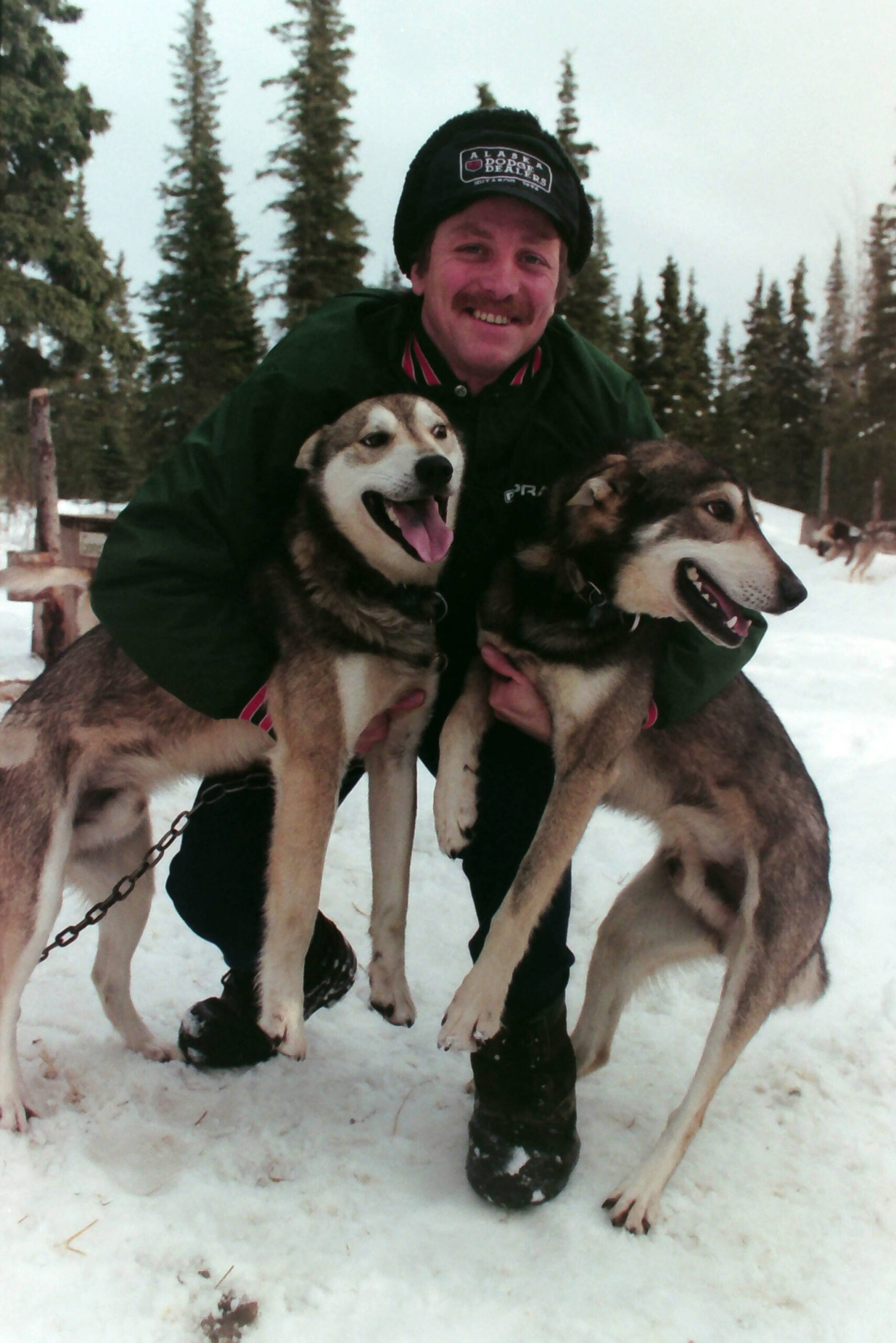 Paul Gebhardt is photographed with two of his dogs on March 24, 1996. (M. Scott Moon/Peninsula Clarion)