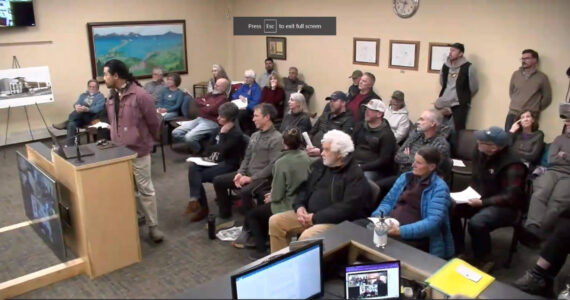 A full audience listens to presentations and public testimony on the proposed development at the site of the former Lighthouse Village on Wednesday, Dec. 6, 2023 in the Homer City Hall Cowles Council Chambers in Homer, Alaska. Screenshot.