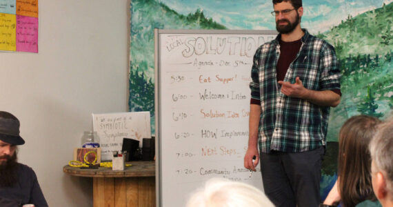 Cook Inletkeeper Energy Policy Analyst Ben Boettger presents information about retrofitting homes to be more energy efficient at the Cook Inletkeeper Community Action Studio on Tuesday, Dec. 5, 2023, in Soldotna, Alaska. (Ashlyn O’Hara/Peninsula Clarion)