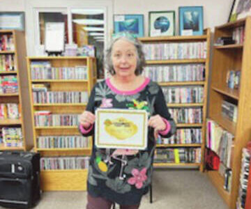 Callie Steinberg/Homer News
Homer Thrift manager Liz Dorn poses with the Best of Business award for “Best Consignment/Thrift Shop” on Friday, Dec. 15<ins>, 2023</ins> in the Homer Thrift store<ins> in Homer, Alaska</ins>.